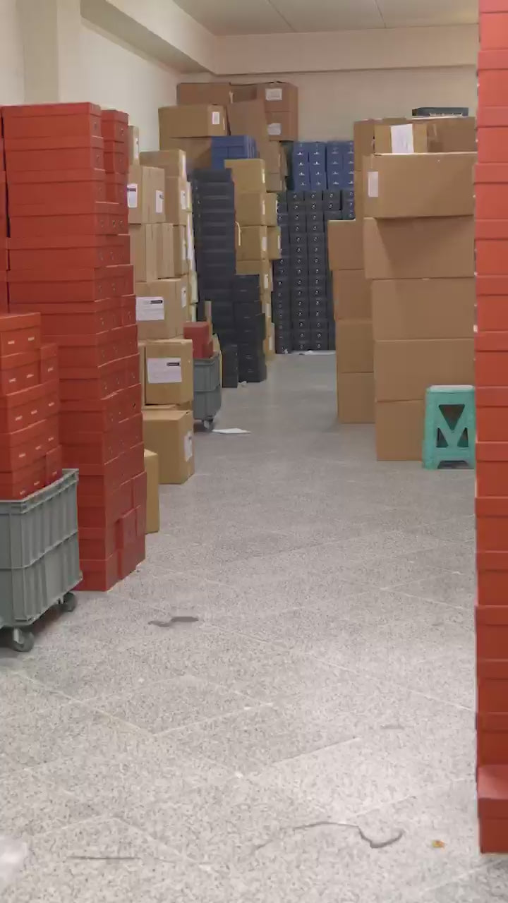 Footwear production stages including cutting, stitching and lasting